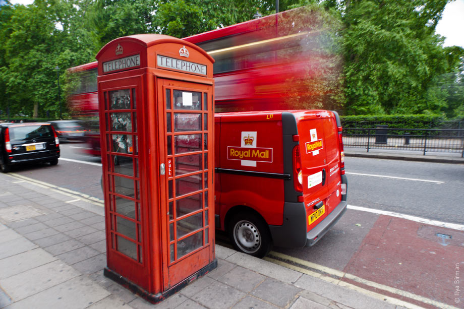 A phone booth, a Rolay Mail van and a bus in London