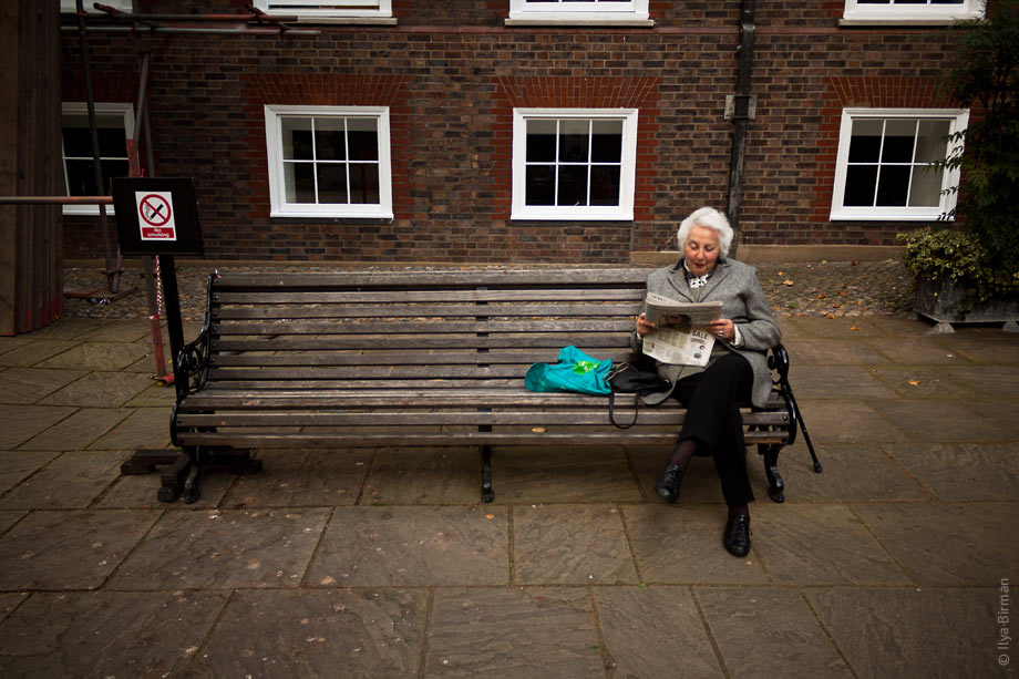 A woman with a newspaper