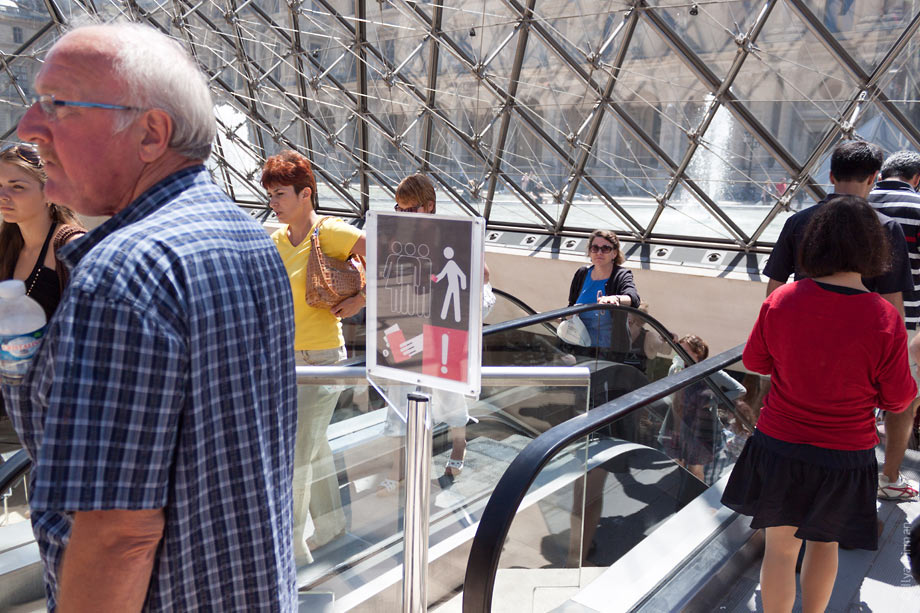 A strange sign is installed in Louvre