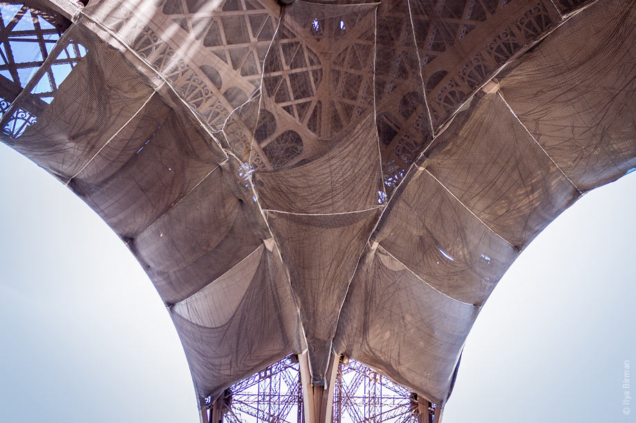 The Eiffel Tower is covered with shabby rags
