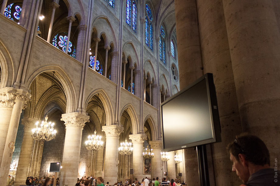 Plasma display panels are mounted to the walls of Notre Dame de Paris