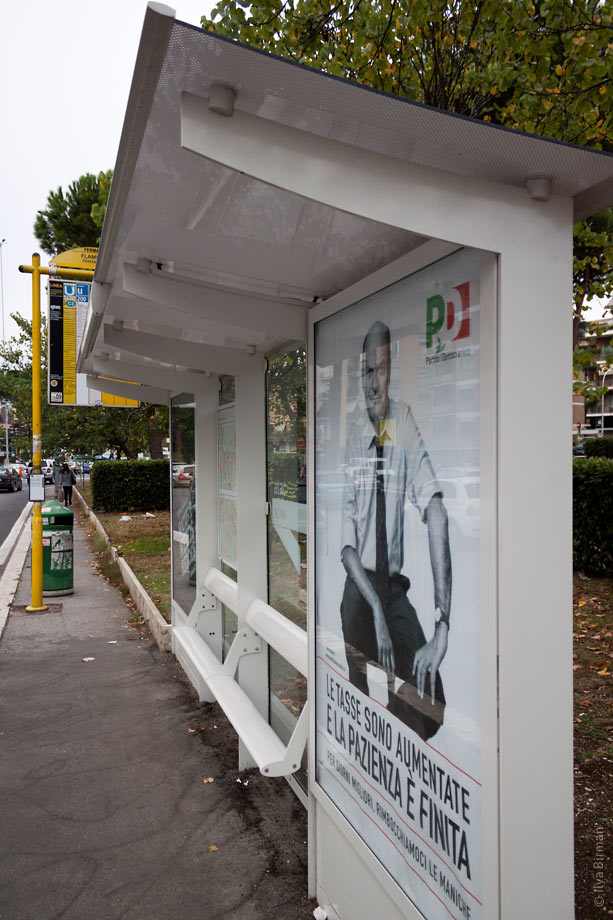 A bus stop with an integrated bench